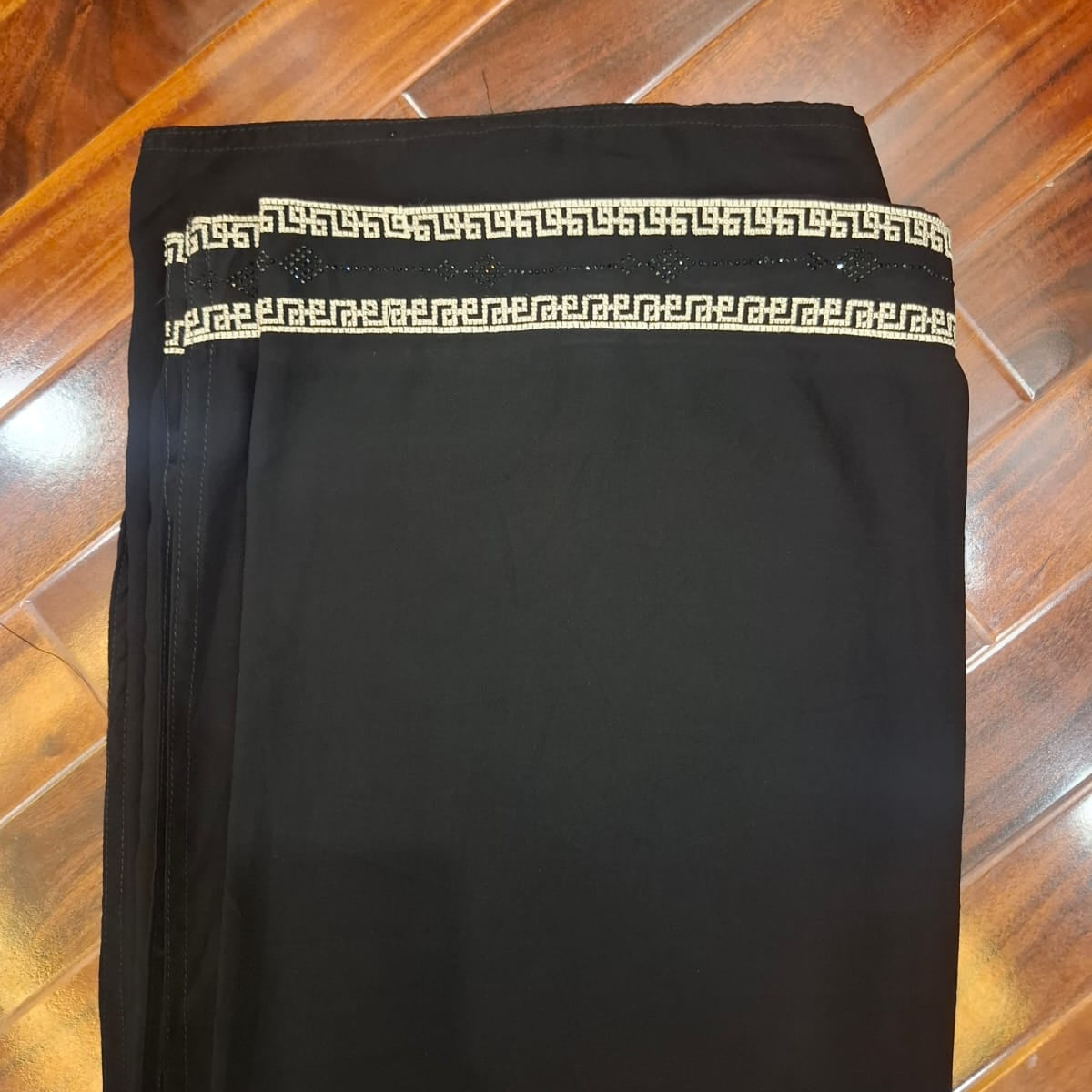 Black shawl with decorative trim